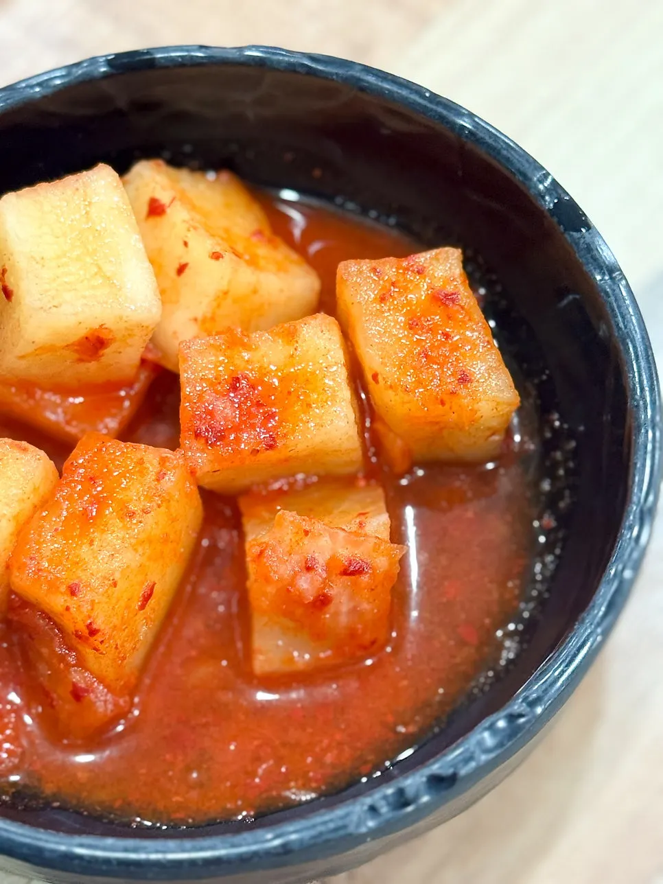 Rice mixed into the broth alongside kkakdugi