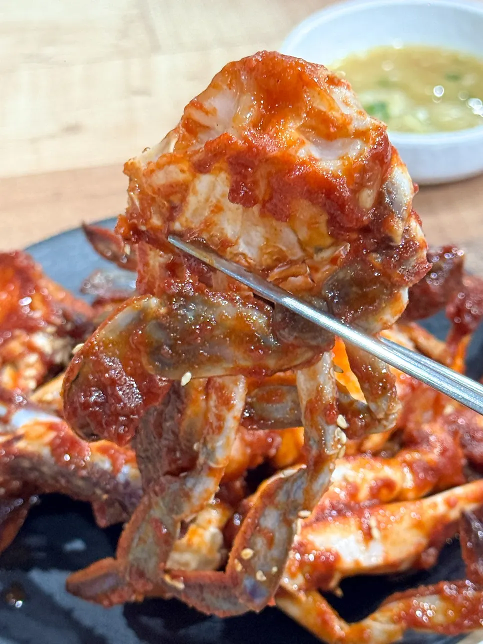 A piece of crab coated in spicy seasoning