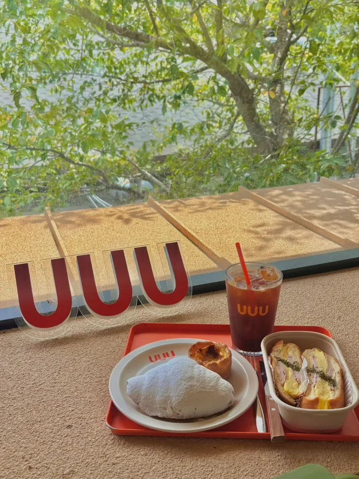 Americano, sandwich, and dessert spread