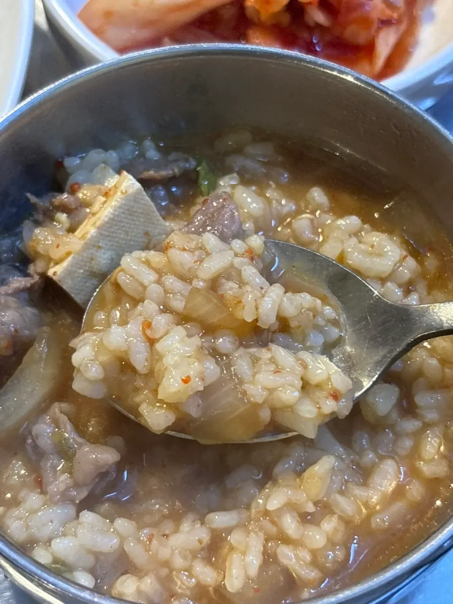 Close-up of doenjang jjigae with plenty of onion