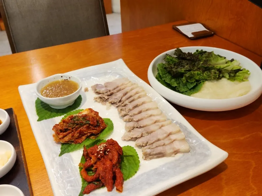 Plate of thinly sliced boiled pork bossam