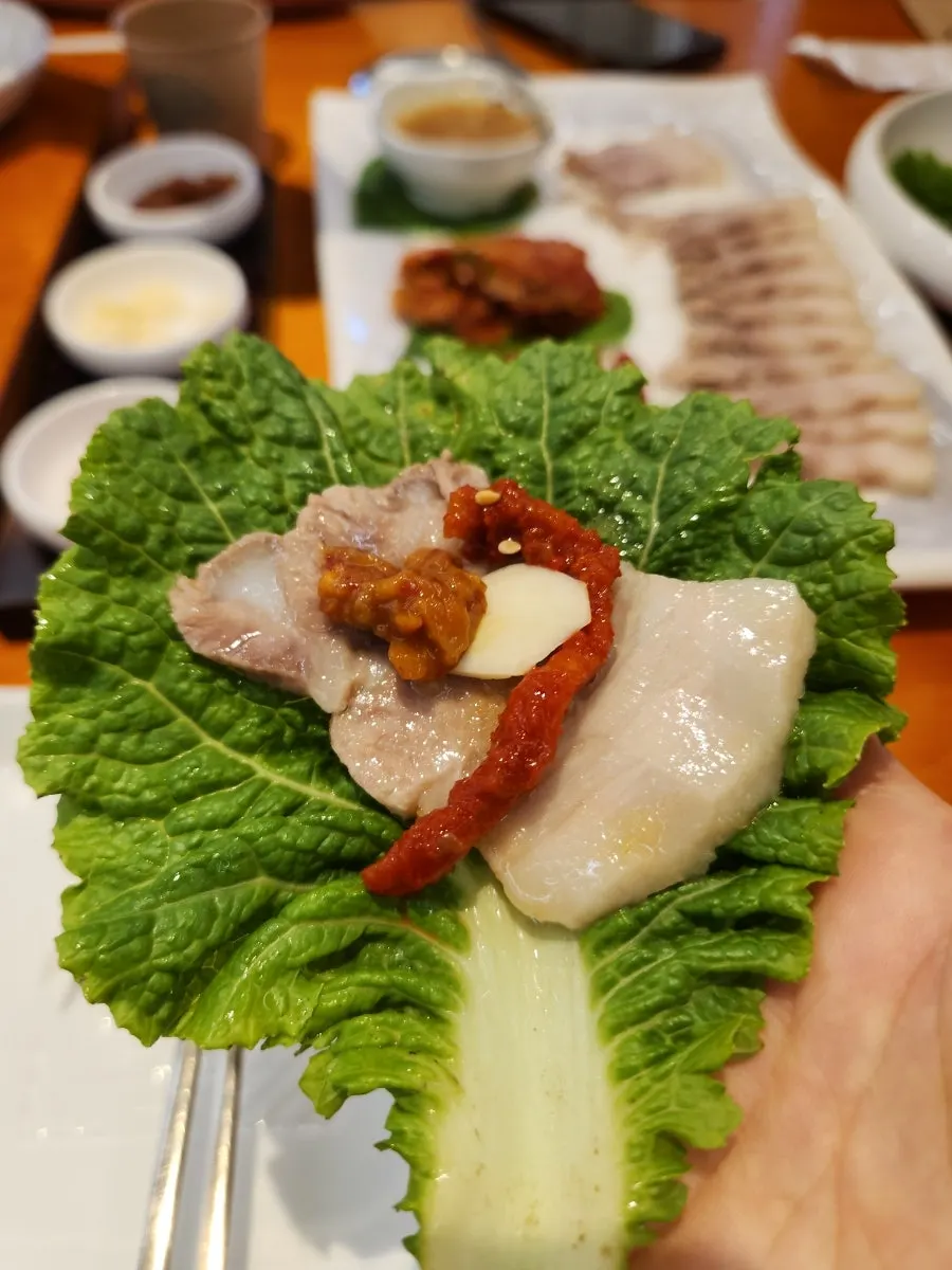 Lettuce wrap with pork, kimchi and pickled radish