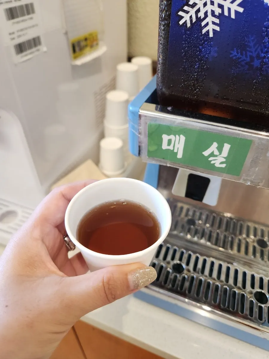 Coffee vending machine and plum tea at the entrance dessert corner