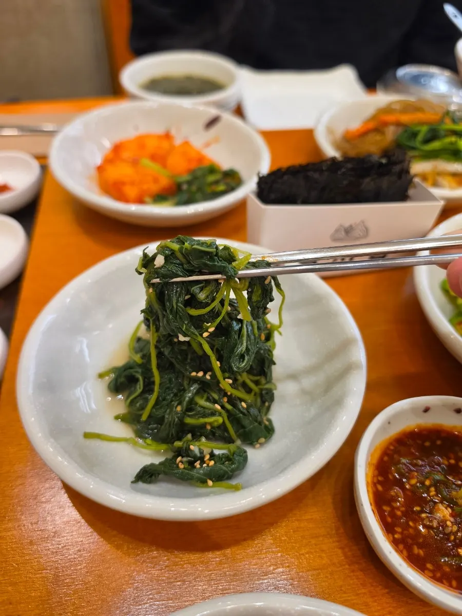 Side dishes and soup from the set menu at Gaya Kkeutjip