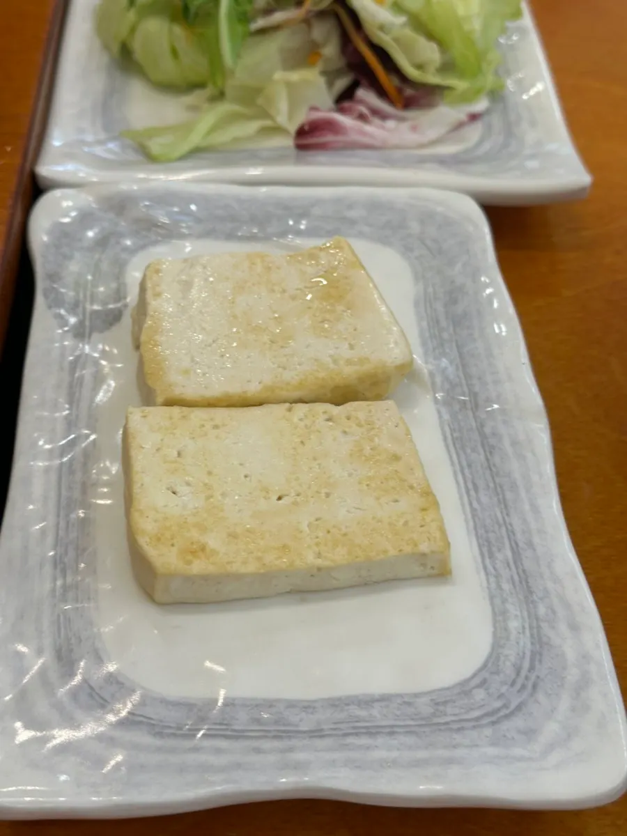 Seasoned crab included in the standard banchan at Gaya Kkeutjip