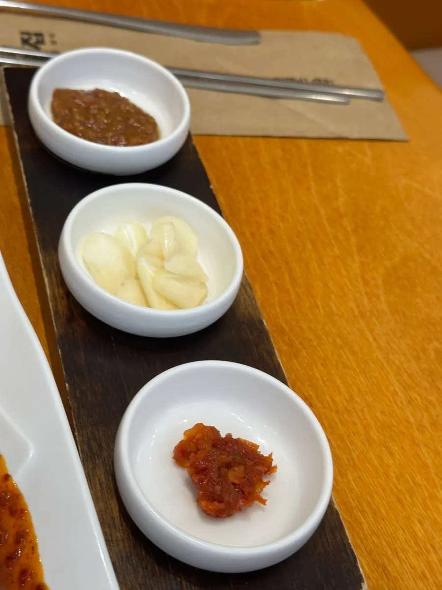 Dipping sauces served alongside the lettuce wraps at Gaya Kkeutjip