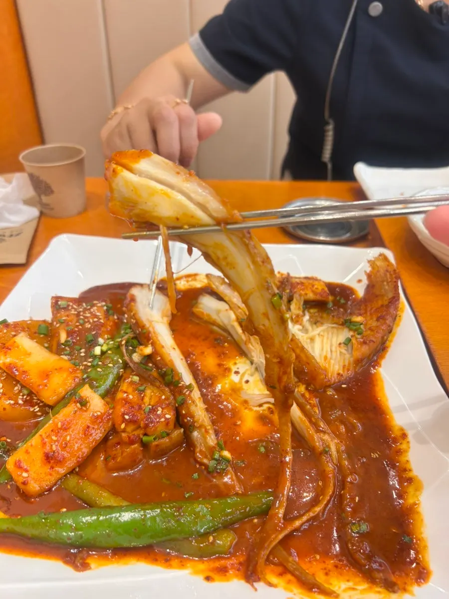 Close-up of the sauce-coated steamed ray at Gaya Kkeutjip