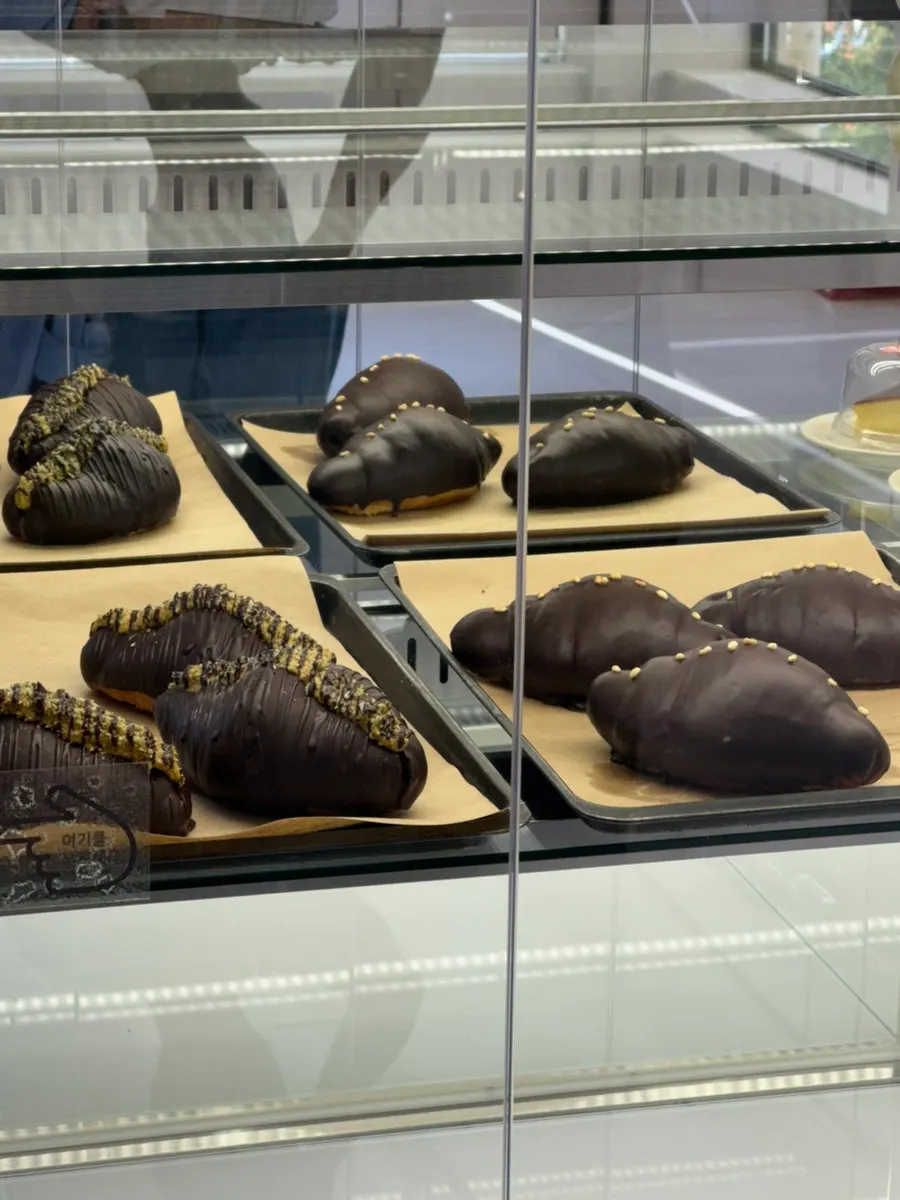Display of sausage hot dogs and tigré cakes