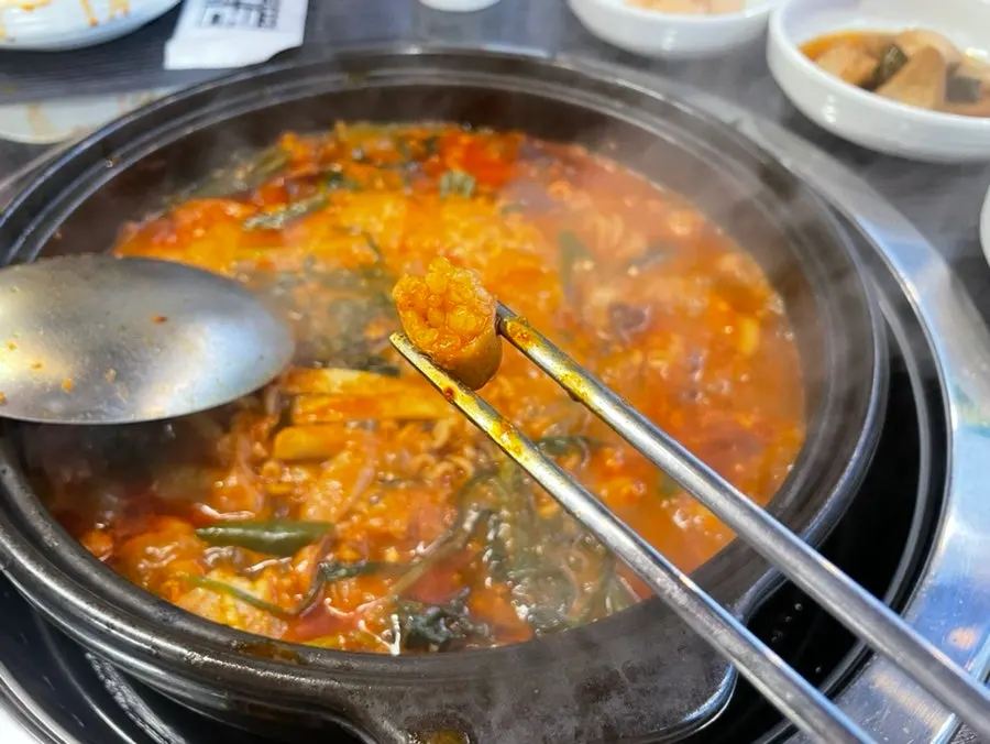 Beer served alongside tripe hot pot