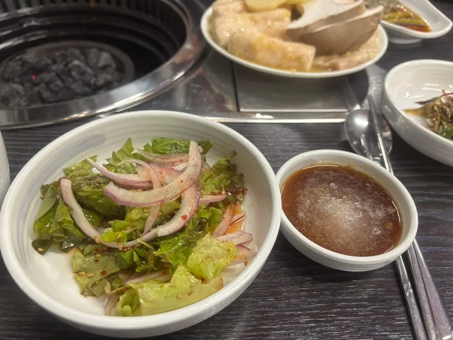 A piece of daechang placed on a grilled potato
