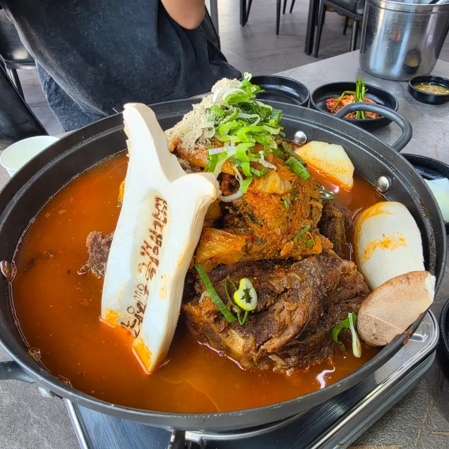 Pot of rich, thick gamjatang broth