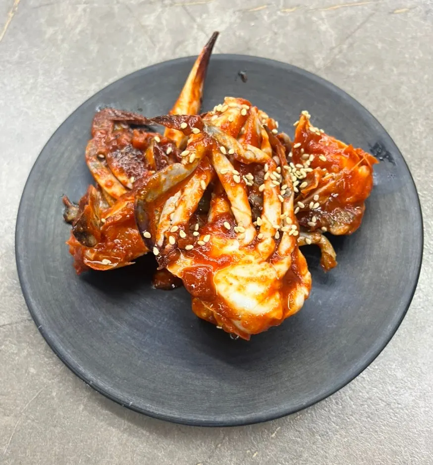 Seasoned marinated crab served with the set for two