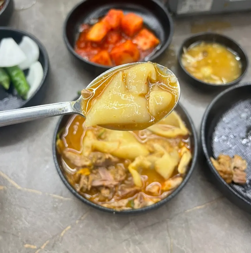 Freshly cooked stone pot rice topped with gamjatang meat