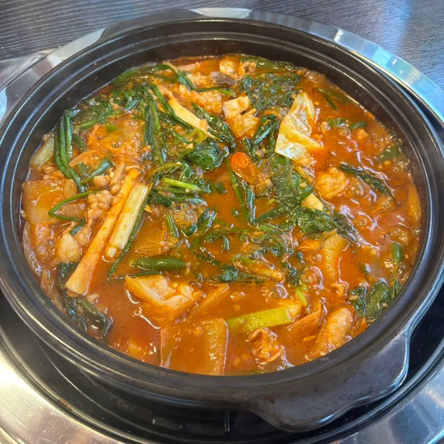 Spread of basic banchan including stir-fried fish cake and anchovies