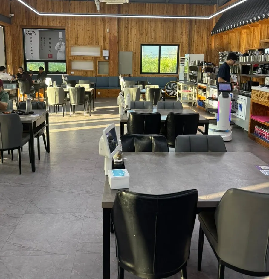 Interior with widely spaced 4-person tables