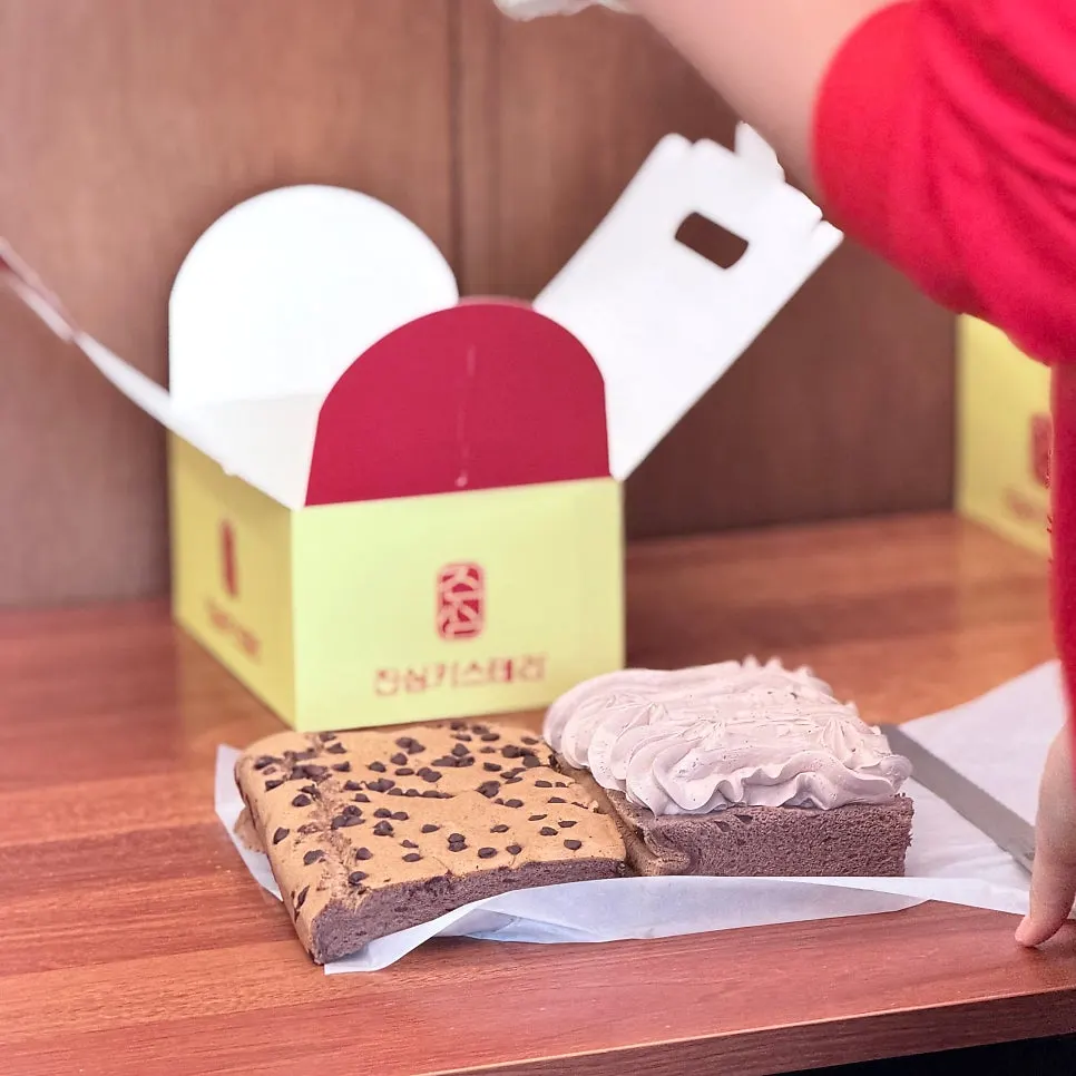 Two boxed Jinsim Castella cakes ready for takeout