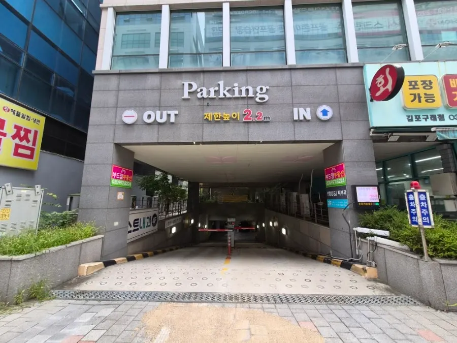 Entrance to the underground parking lot behind the building
