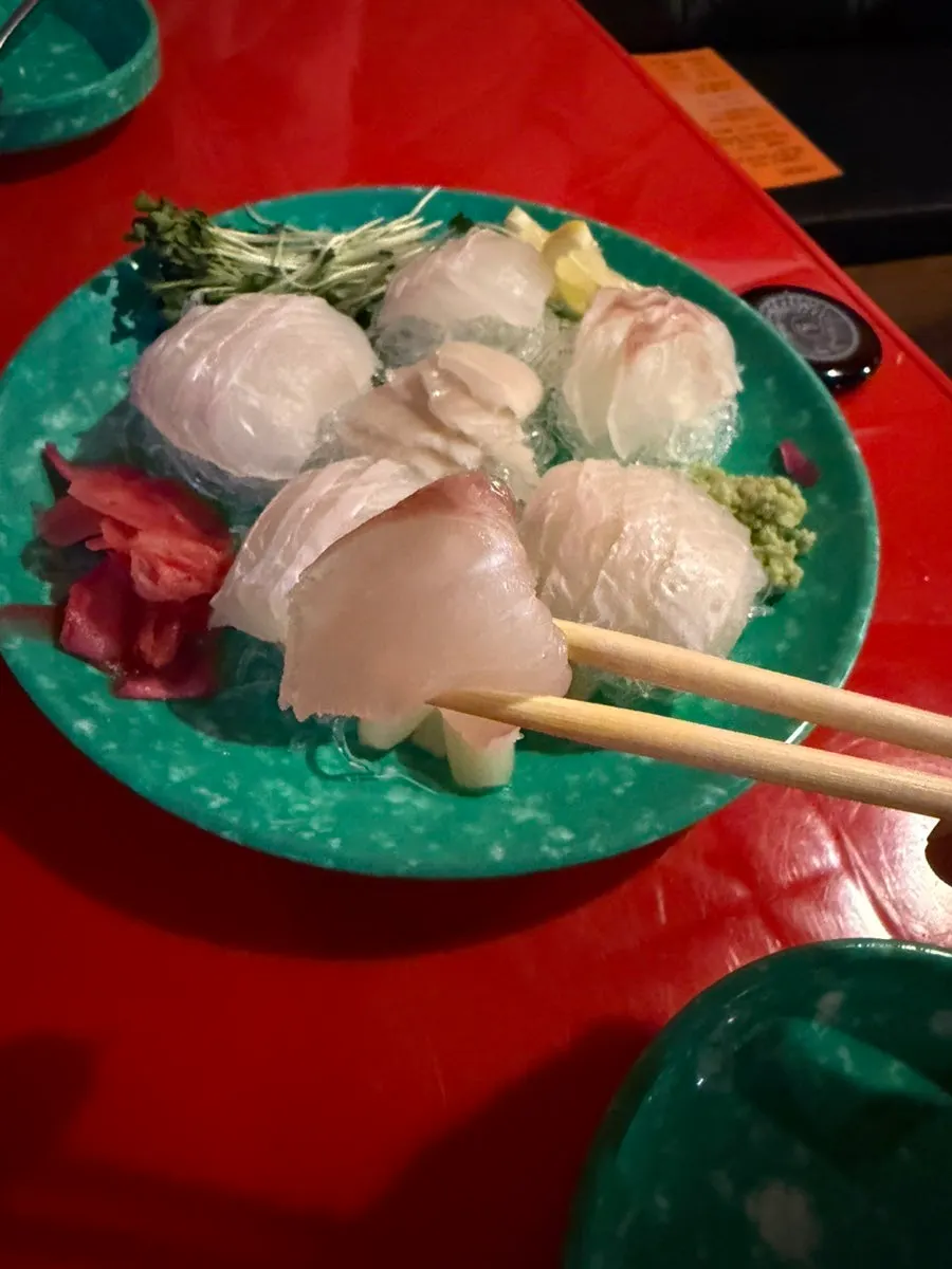 Close-up of one cut of giant flounder sashimi