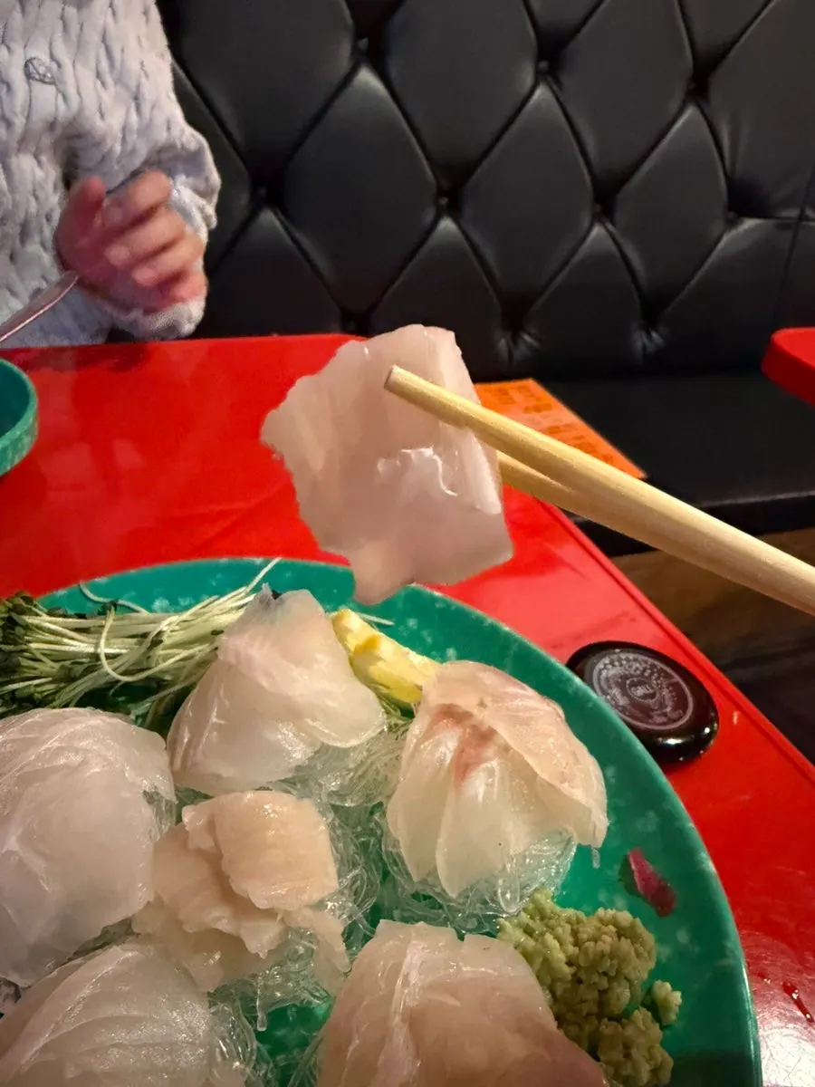 One of the six cuts of giant flounder sashimi