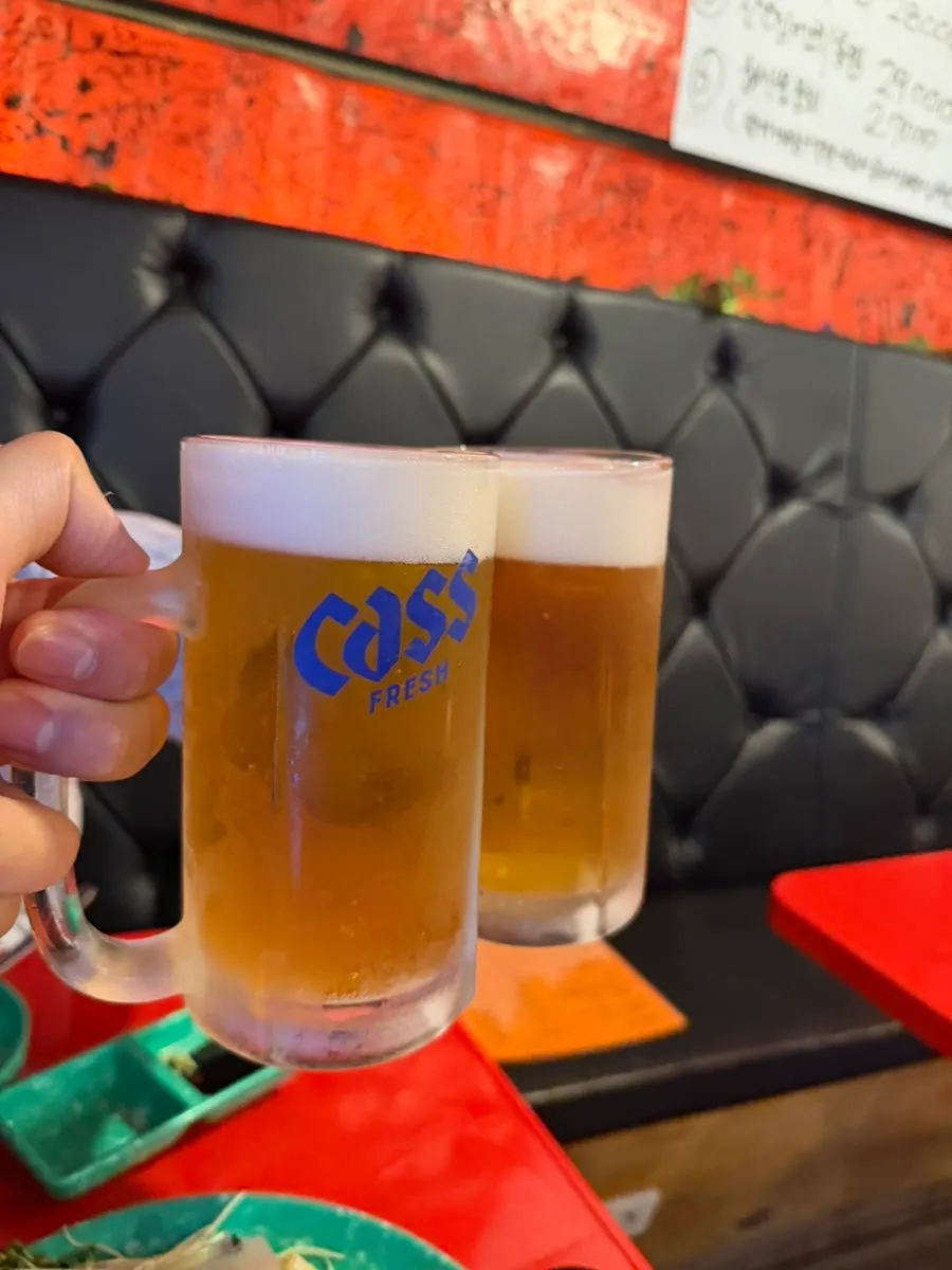 Draft beer and soju enjoyed alongside the sashimi