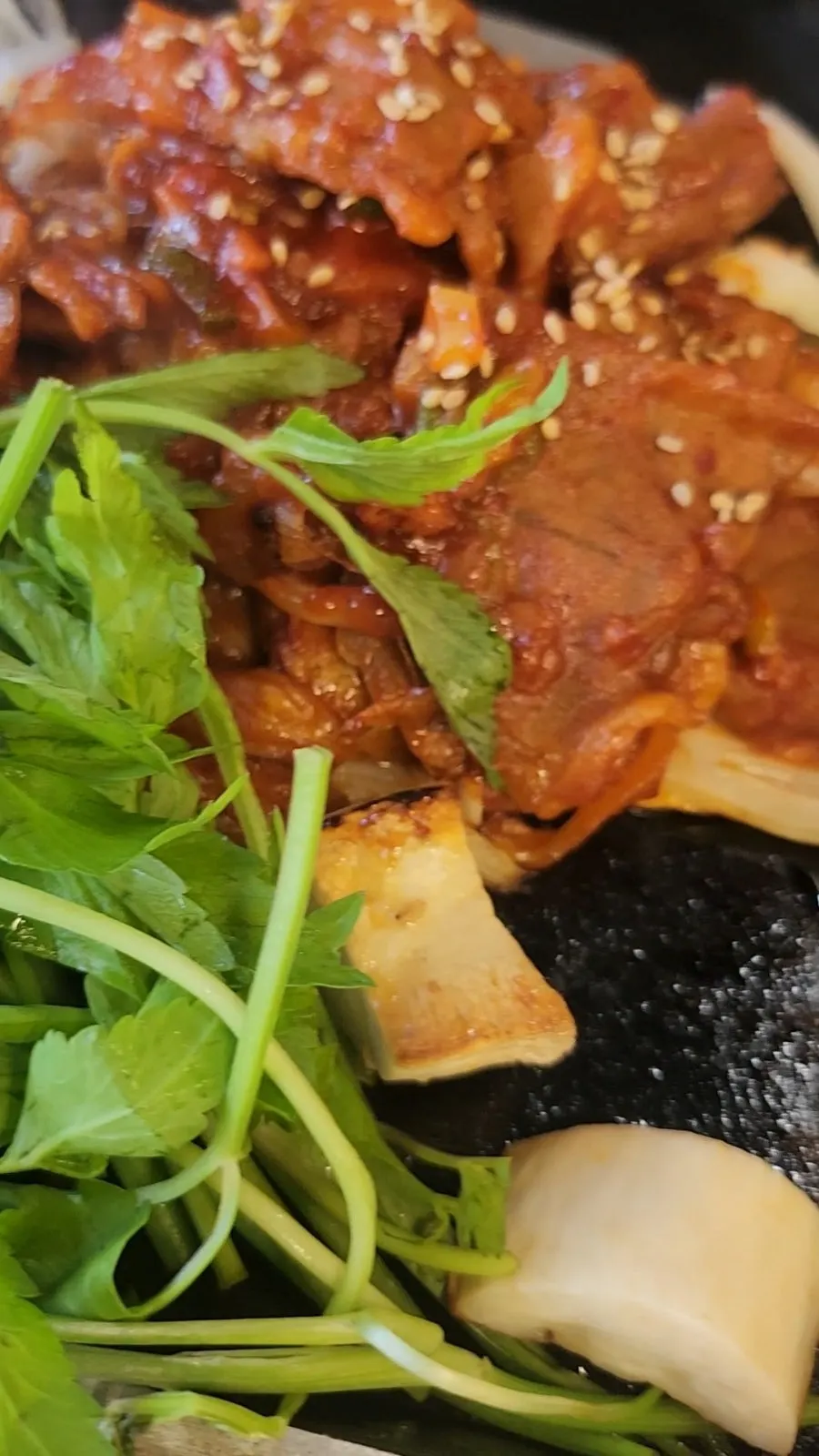 Meat plate served with mushrooms and minari