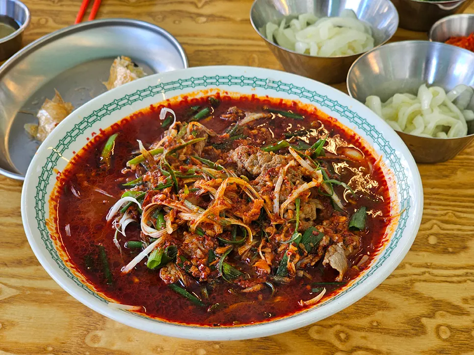 Fire-grilled pho, nem, and side dishes