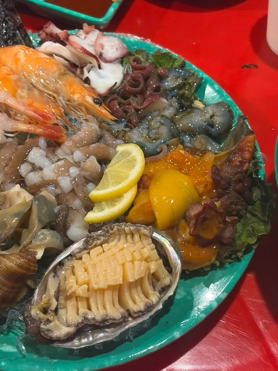 Assorted seafood platter including live octopus