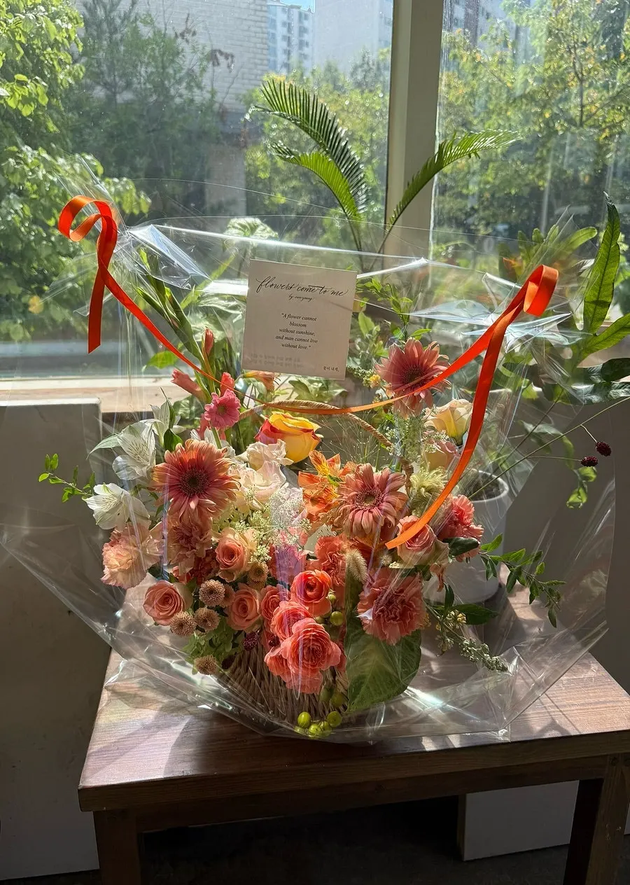 Orange-coral and cream flower basket