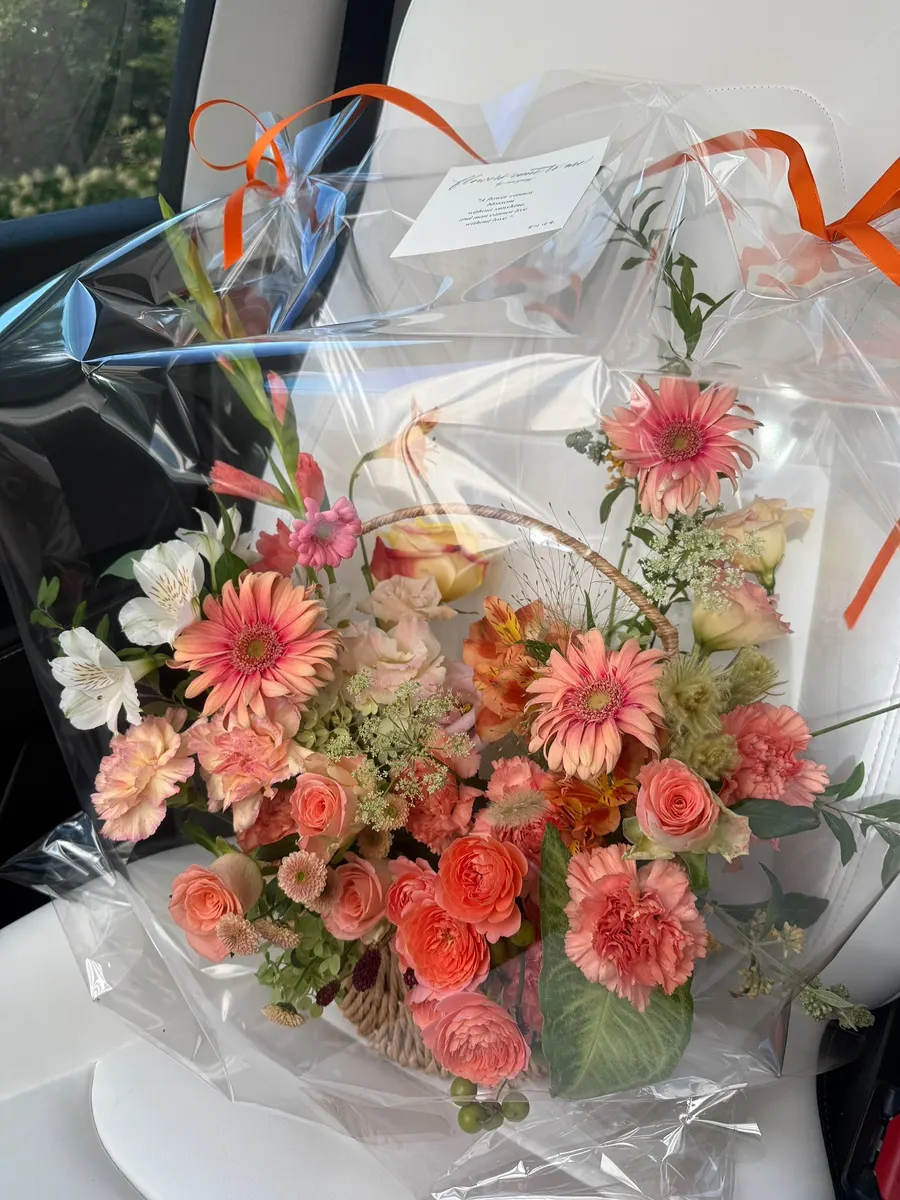 Flower basket being carried after pickup