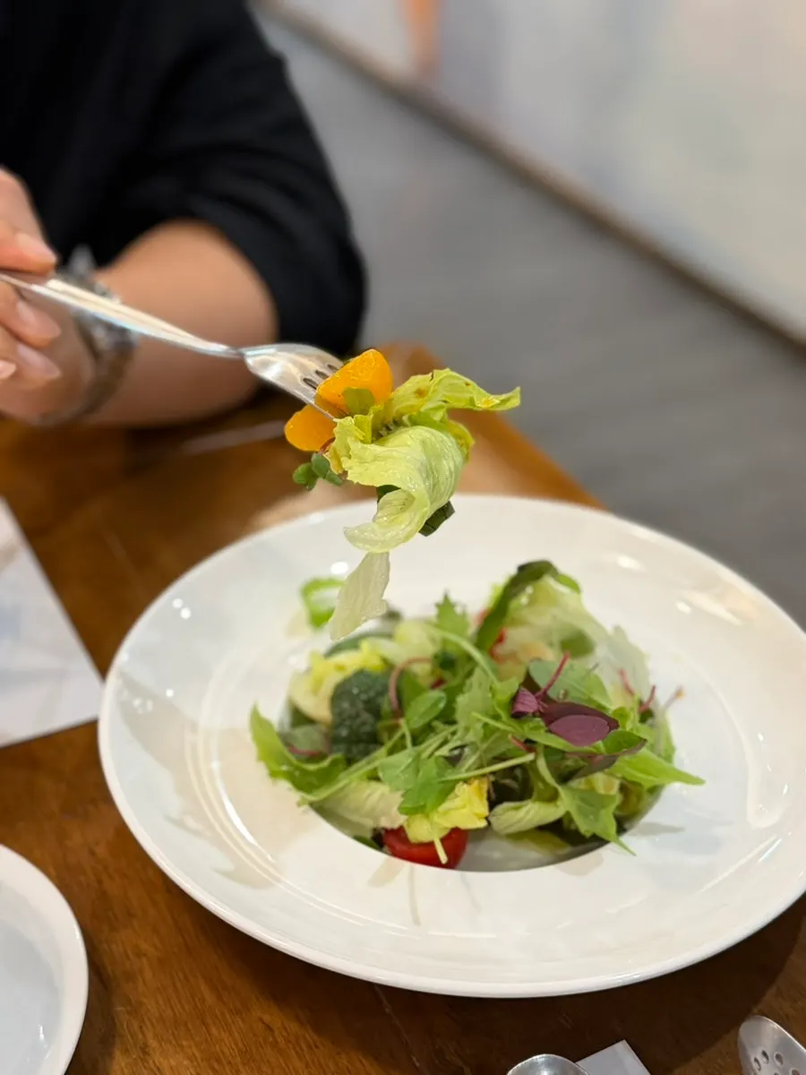 Salad topped with cherry tomatoes and fruit