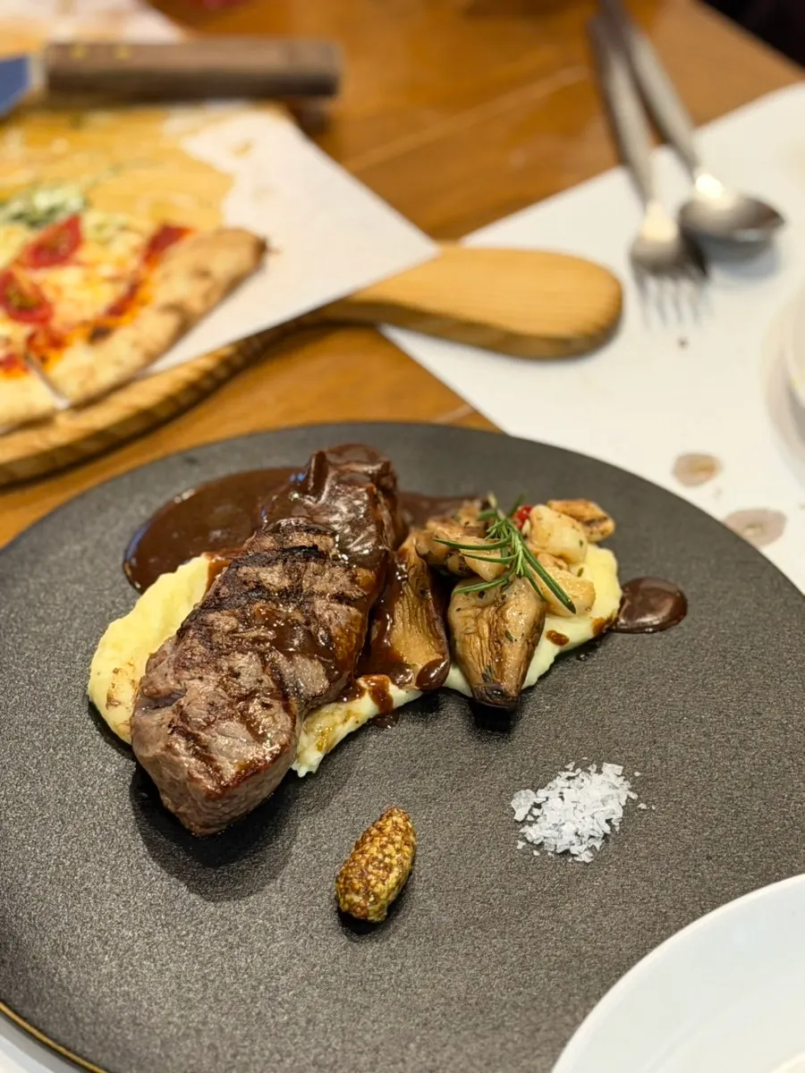 Sirloin steak served with sauce and garnish