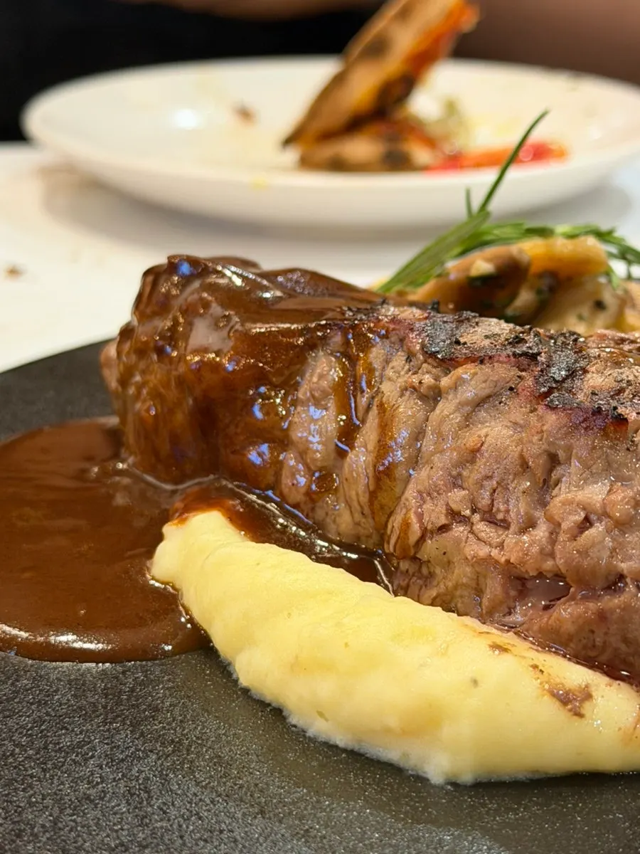 Steak served with salt and whole grain mustard