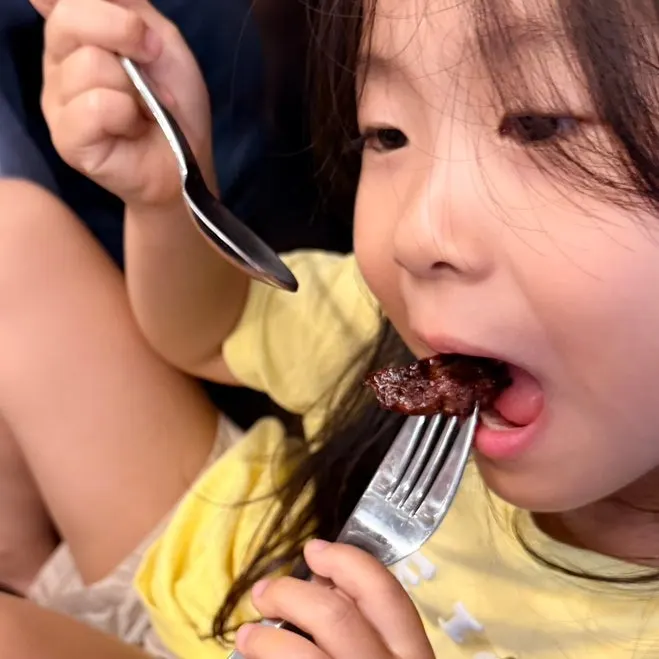 A piece of king pork rib cut small for the child
