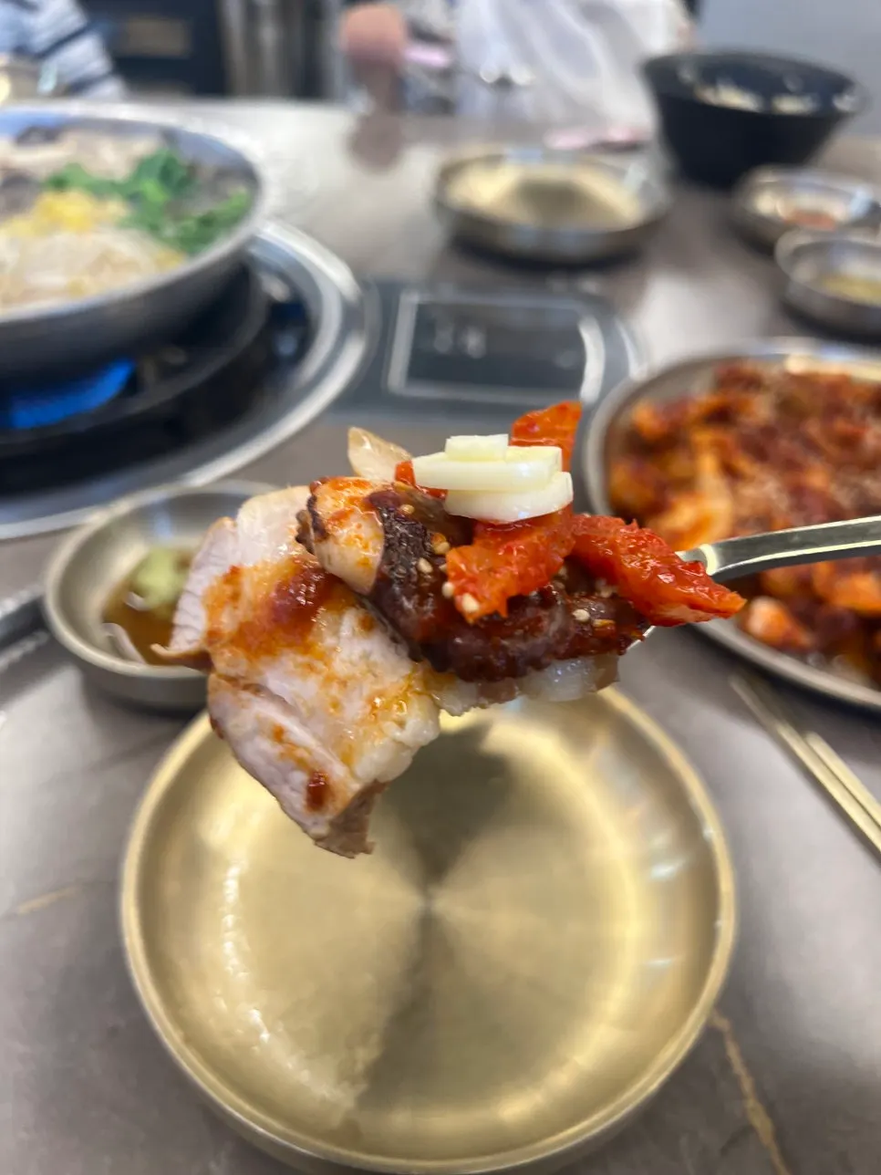 A piece of octopus placed on top of boiled pork