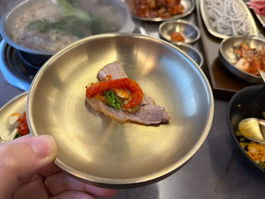 Onsuyuk boiled in agaricus mushroom broth with shredded radish for bossam