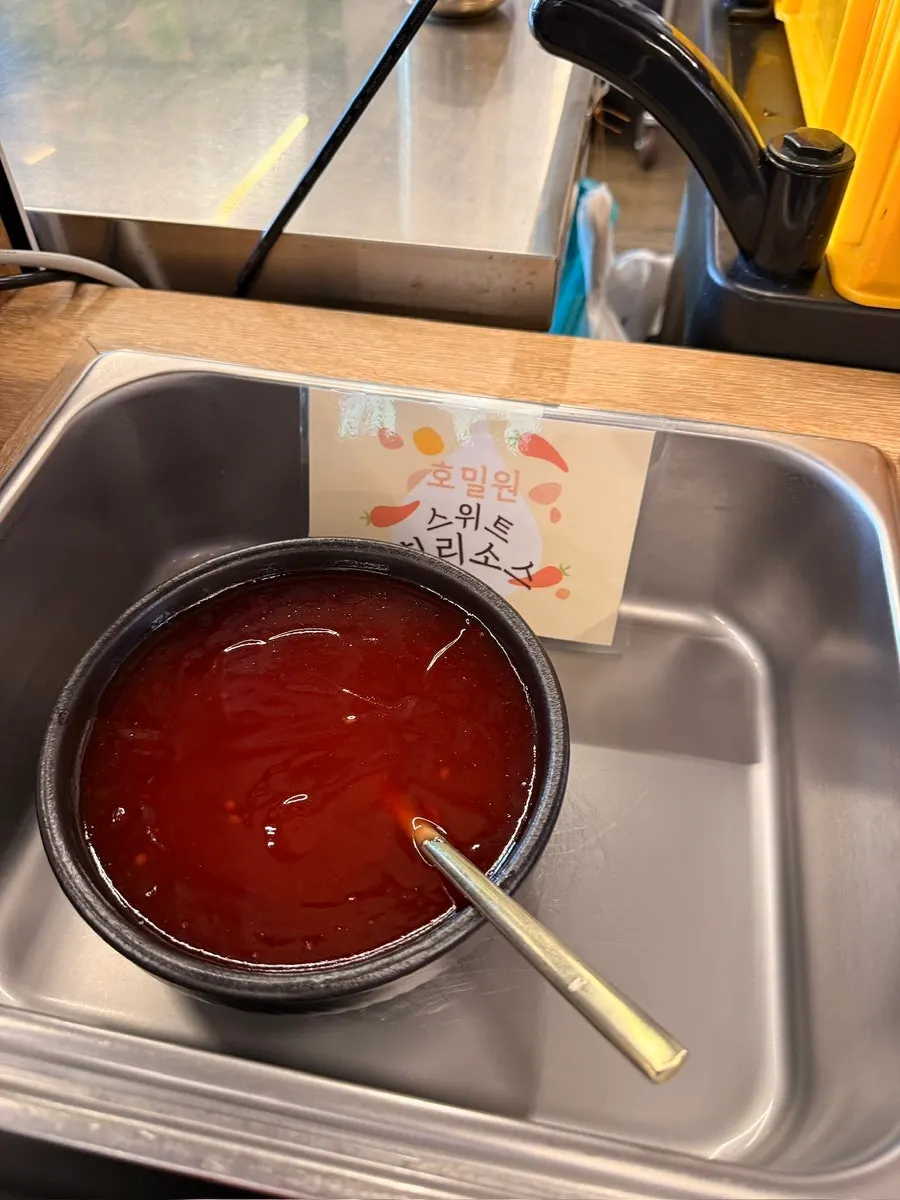 Self-bar sweet chili sauce and condiment corner