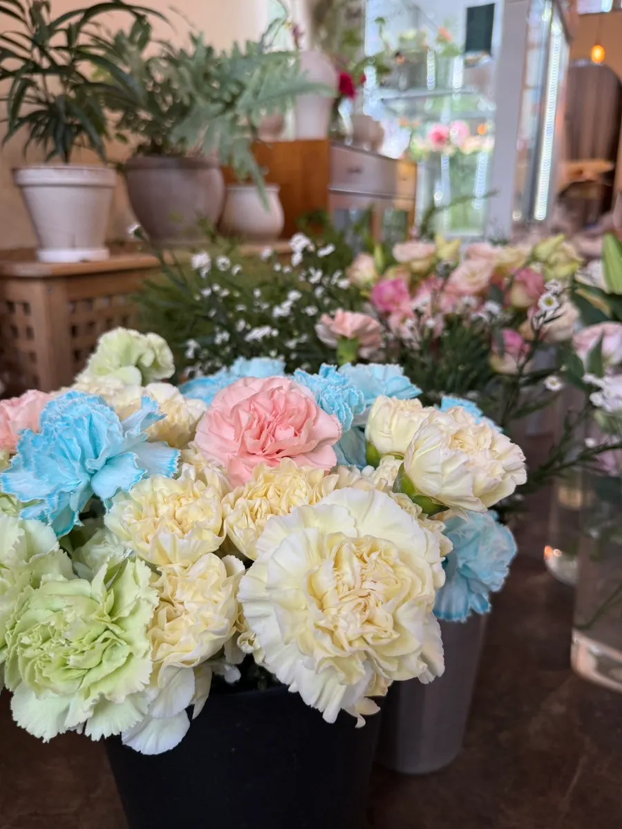 Beige and wood-toned flower shop interior and flower display