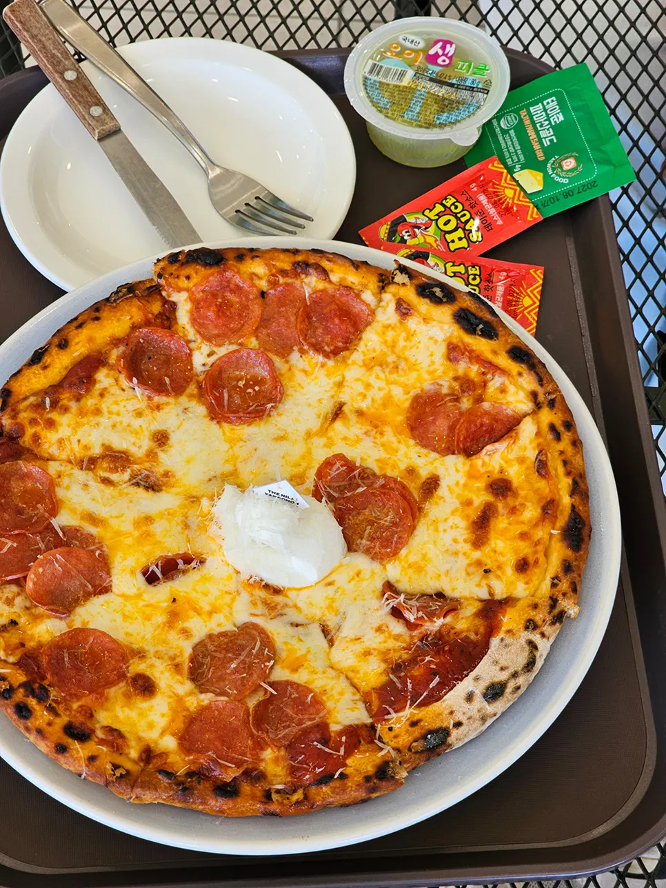 Pizza topped with cheese and pepperoni