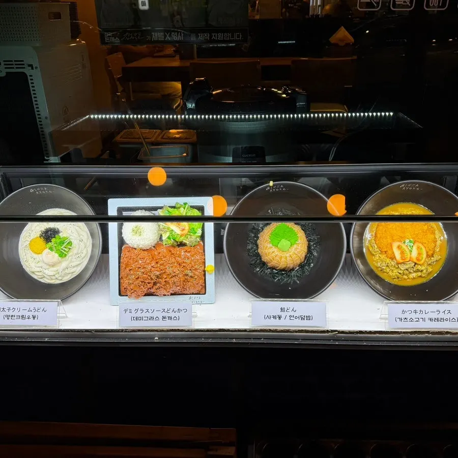 Food models of signature menu items displayed outside the restaurant