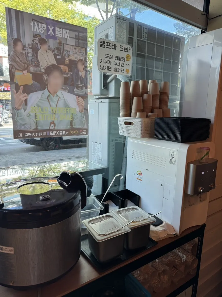 Menu board listing curry dishes and udon