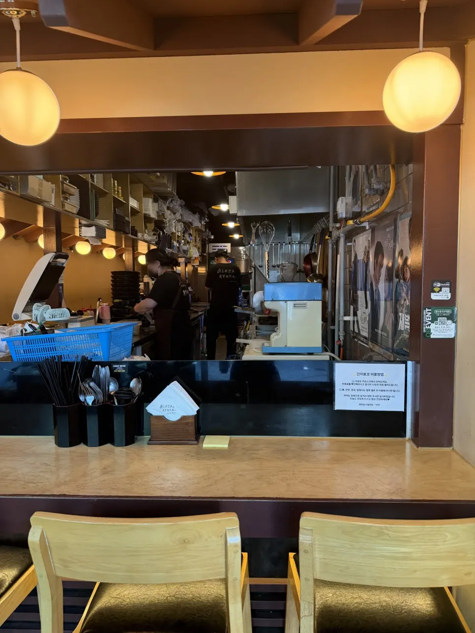Tachi counter seating facing the open kitchen