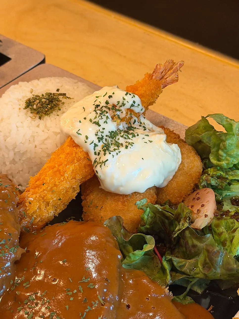 Close-up of donkatsu topped with demiglace sauce