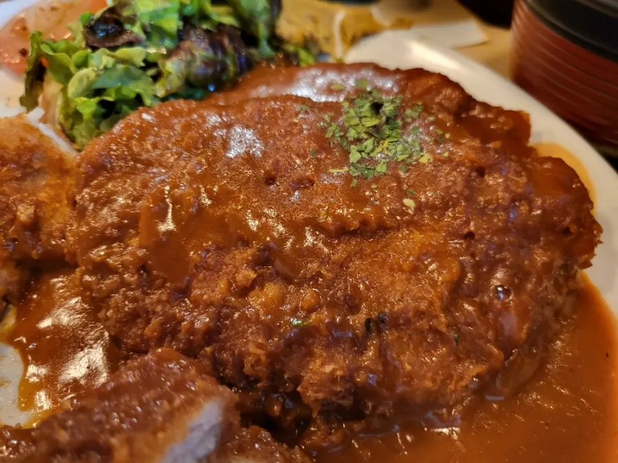 Cross-section of a thickly cut pork cutlet