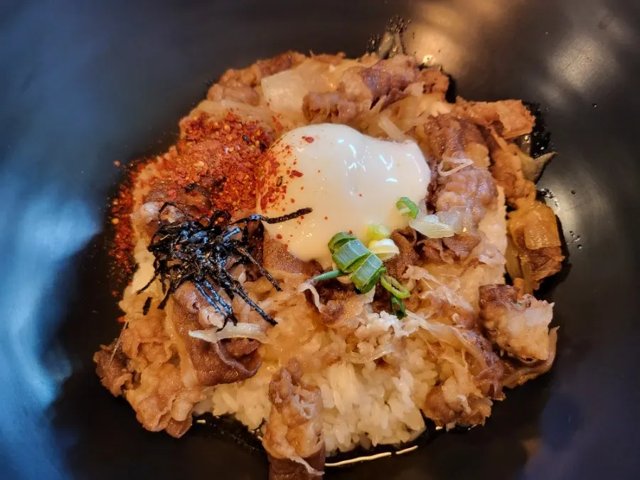 Plate of rice mixed with the poached egg