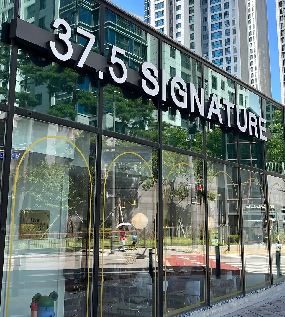 Floor-to-ceiling glass exterior of 37.5 Signature Mia Branch