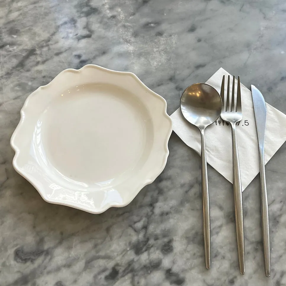 Brunch table setting with cutlery and napkins