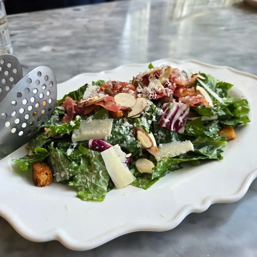 Caesar salad topped with romaine and garlic croutons