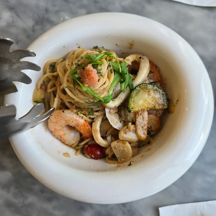 Close-up of myeongnan oil pasta loaded with seafood