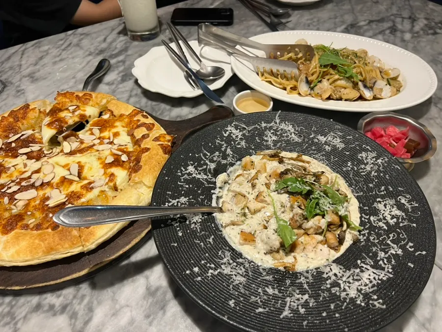 Table with three people eating together