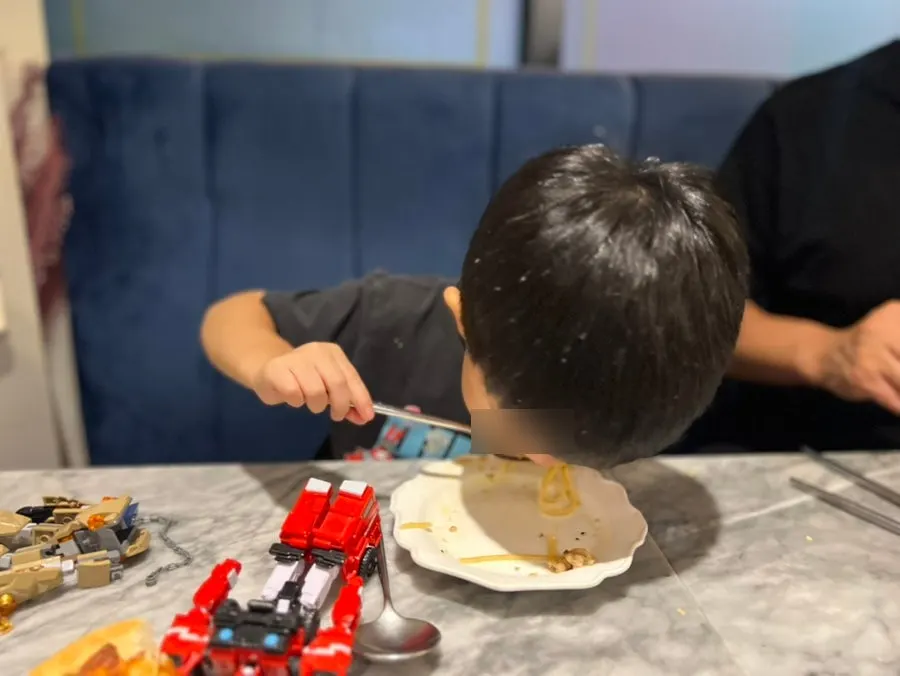 A child eating on their own
